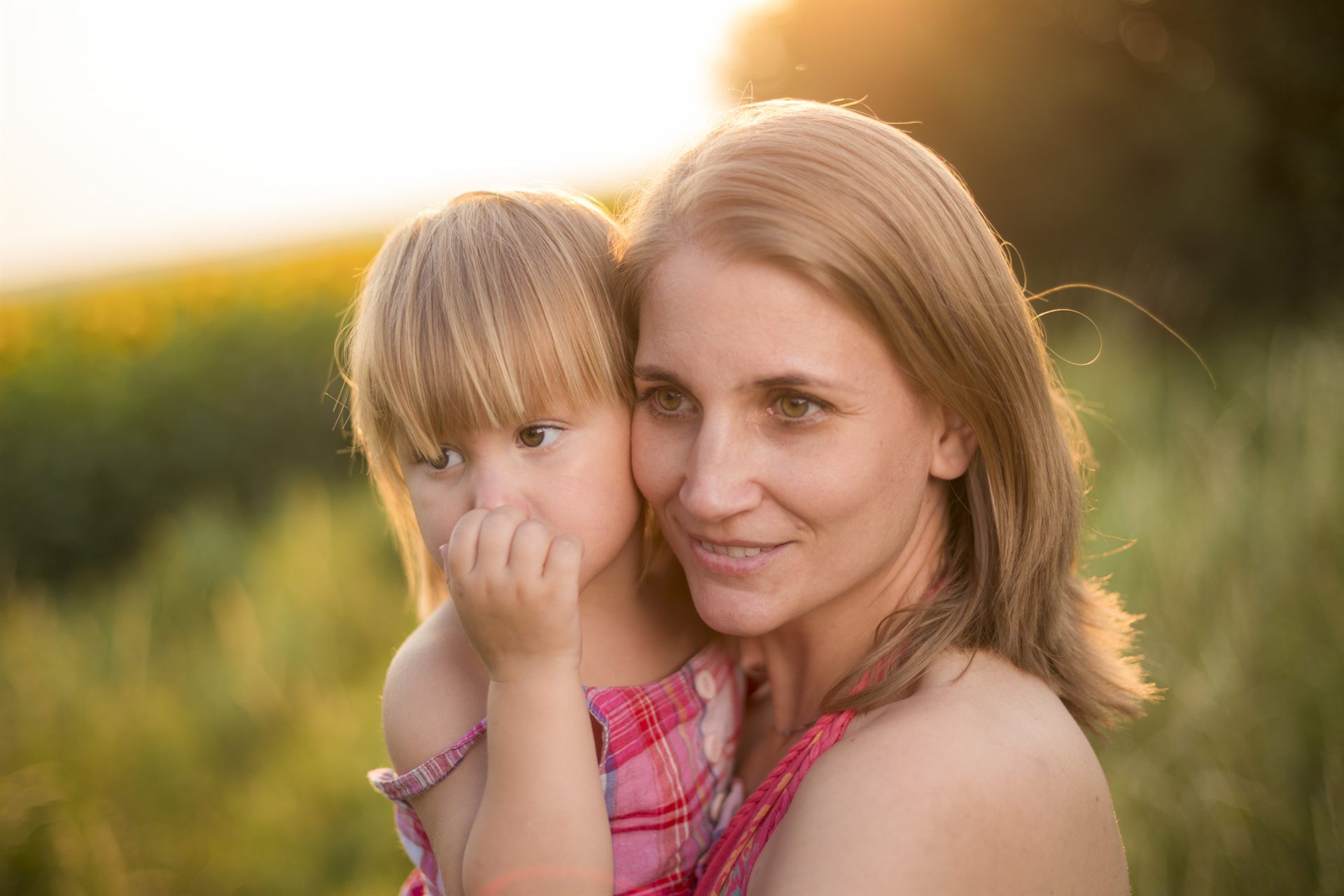 Mother and daughter at golden sunset in Fañabé