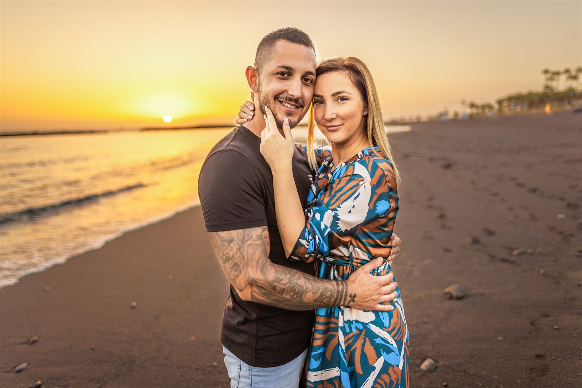 Romantic couple at golden sunset on Playa del Duque