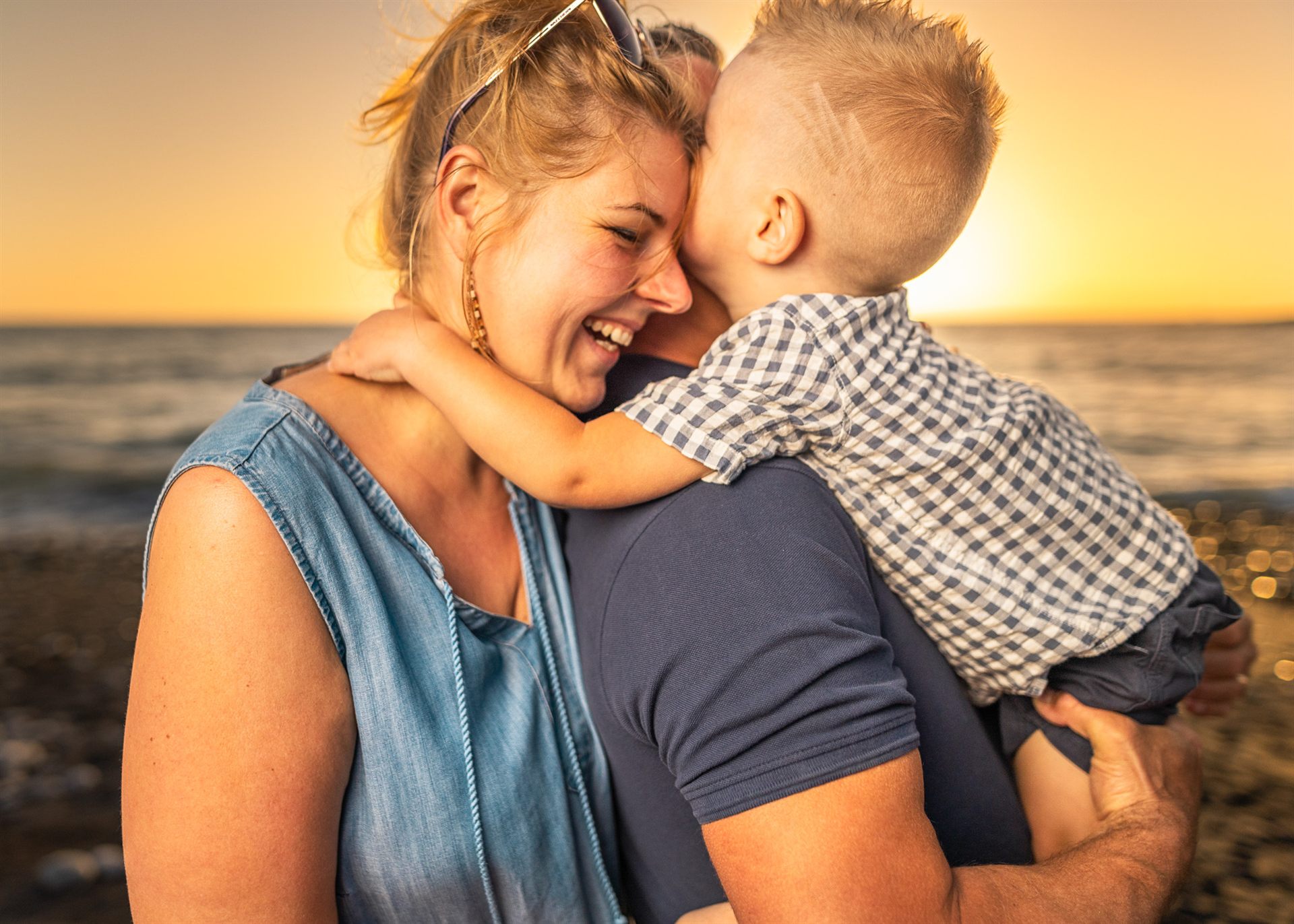 Family at golden sunset on Playa de la Enramada, Costa Adeje